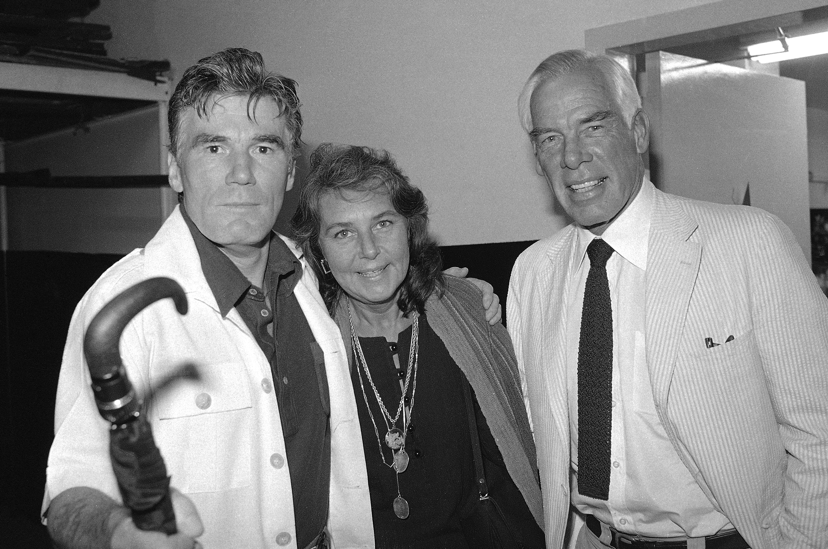 FILE – Actor Lee Marvin, right, and his wife, Pamela, visit with Mitchell Ryan, star of Arthur Miller’s play “The Price,” backstage at the Playhouse Theater in New York in July 1979.