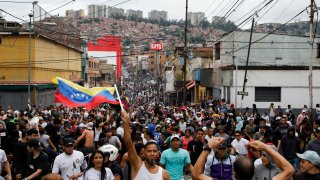Protesters demonstrate against the official election results declaring President Nicolas Maduro won reelection in the Catia neighborhood of Caracas