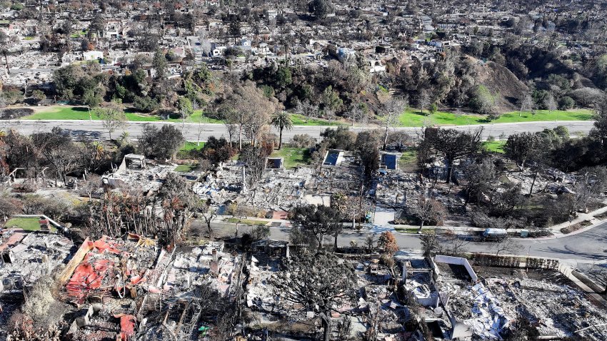 PACIFIC PALISADES, CALIFORNIA – JANUARY 27: An aerial view shows homes destroyed in the Palisades Fire on January 27, 2025 in Pacific Palisades, California. Rain and snowfall across Southern California has temporarily tamed the threat of major wildfires in the region. Multiple wildfires fueled by intense Santa Ana Winds burned across Los Angeles County leaving at least 28 dead with over 180,000 people having been under evacuation orders. Over 12,000 structures, many of them homes and businesses, burned in the Palisades and Eaton Fires.  (Photo by Mario Tama/Getty Images)