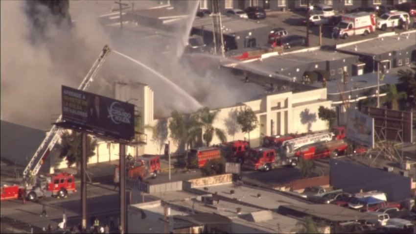 Firefighters respond to a structure fire near East Los Angeles on Tuesday, March 25, 2025.